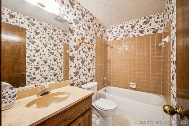 bathroom featuring toilet, a textured ceiling,  shower combination, wallpapered walls, and vanity