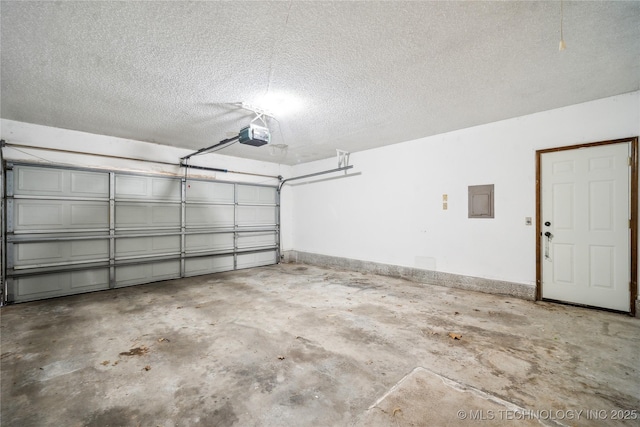 garage featuring electric panel, a garage door opener, and baseboards