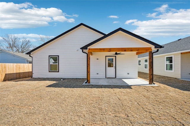 back of house featuring a patio, ceiling fan, and fence