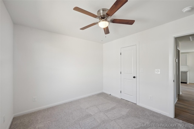 unfurnished bedroom with carpet flooring, visible vents, baseboards, and ceiling fan