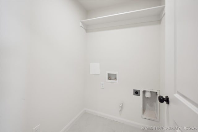 clothes washing area with electric dryer hookup, baseboards, gas dryer hookup, hookup for a washing machine, and laundry area