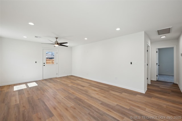 empty room with a ceiling fan, recessed lighting, light wood-style floors, and visible vents