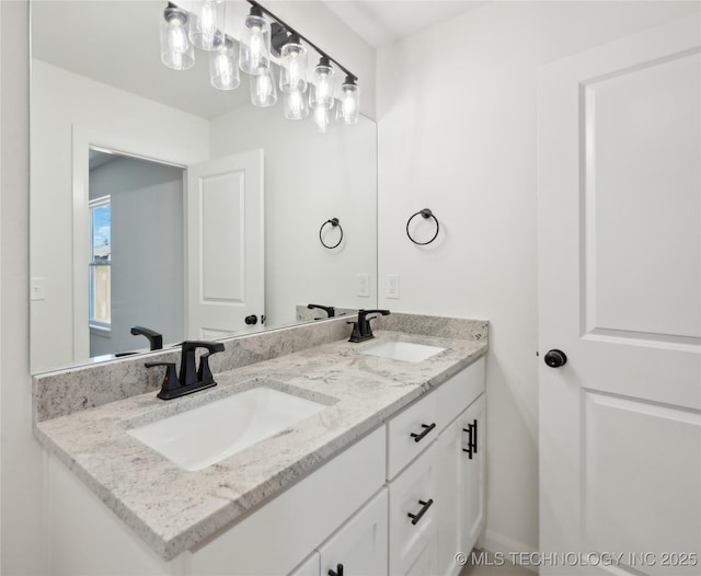 bathroom with a sink and double vanity