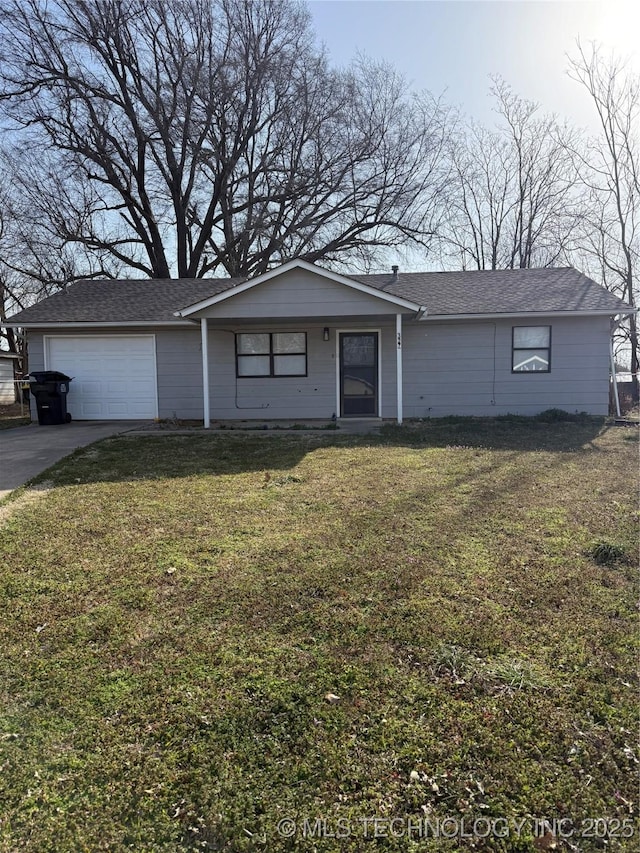 ranch-style house with a garage, driveway, and a front yard