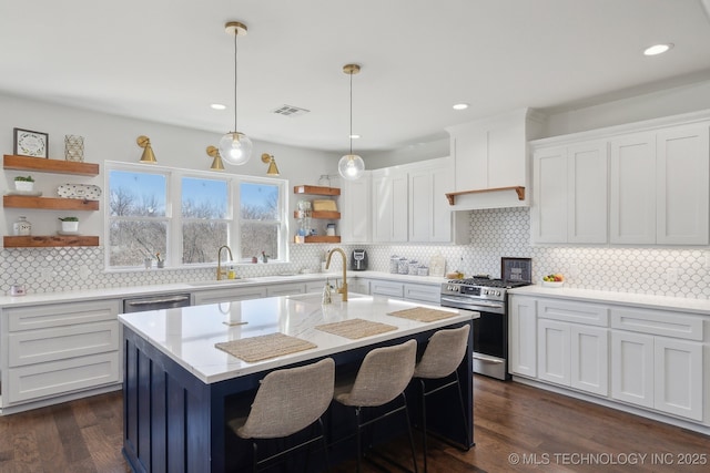 kitchen featuring visible vents, white cabinets, appliances with stainless steel finishes, and open shelves