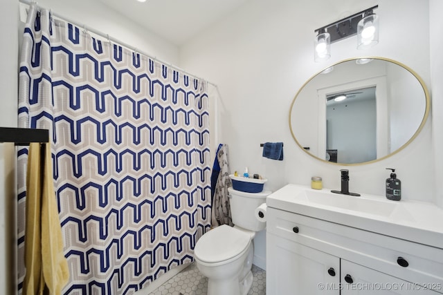 bathroom featuring tile patterned floors, vanity, toilet, and a shower with shower curtain