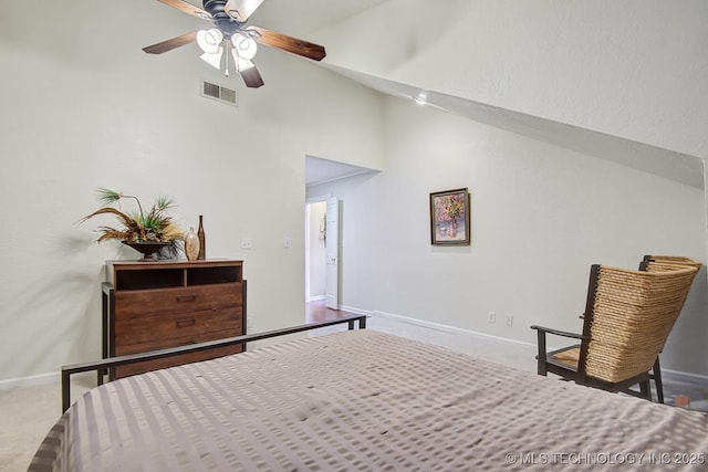 bedroom with visible vents, baseboards, ceiling fan, carpet flooring, and high vaulted ceiling