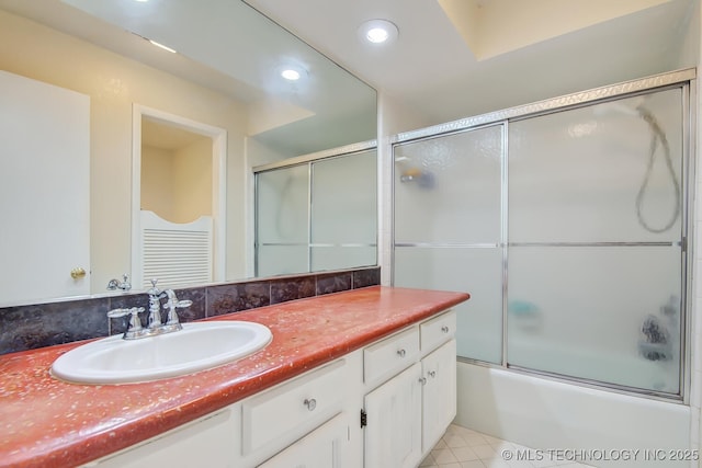 bathroom with enclosed tub / shower combo, tile patterned flooring, recessed lighting, and vanity