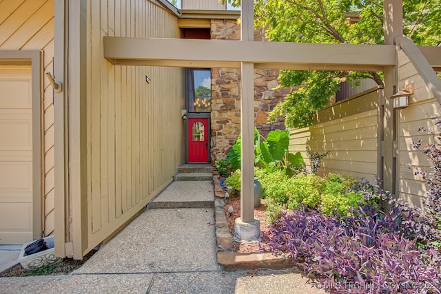 entrance to property with stone siding