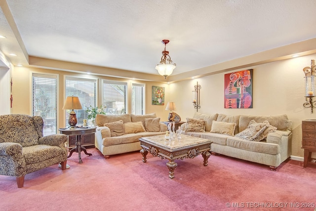 living room with a textured ceiling and carpet floors