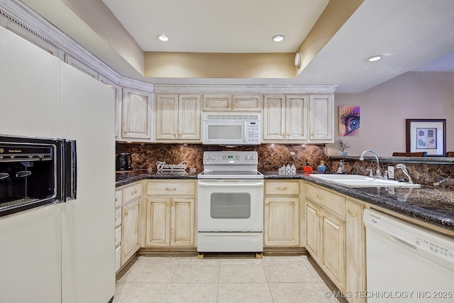 kitchen with a sink, decorative backsplash, white appliances, and light tile patterned floors