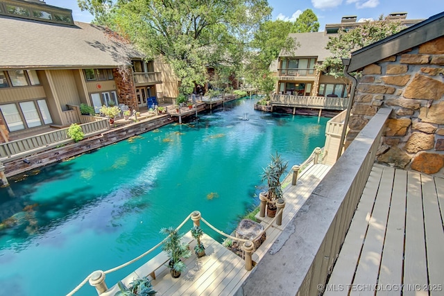 view of swimming pool with a water view