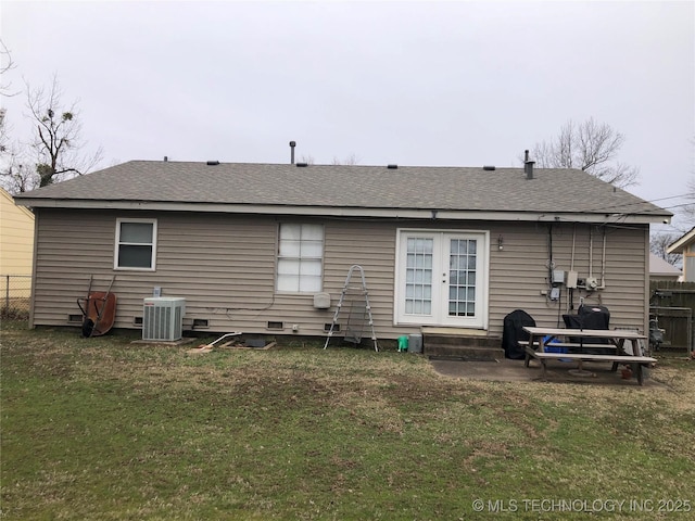 back of house with a lawn, entry steps, central AC, fence, and crawl space