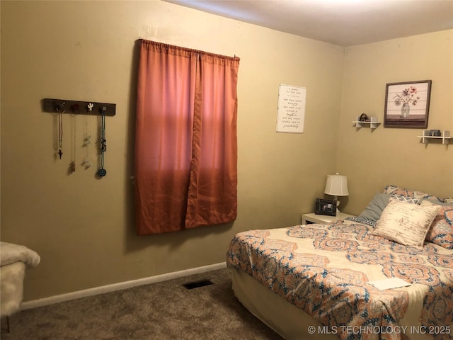 bedroom with visible vents, carpet flooring, and baseboards