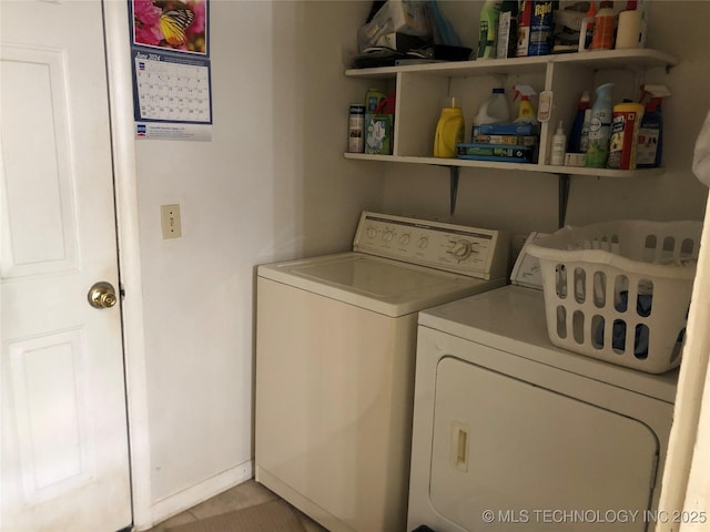 laundry room featuring separate washer and dryer and laundry area