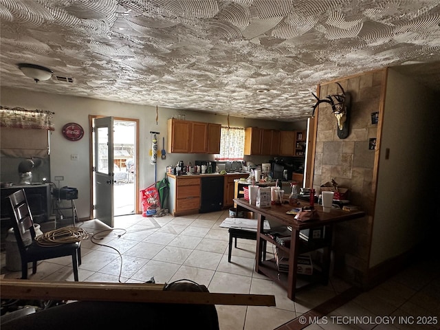 3730 Governor Harris St, Ada, OK 74820 - kitchen with a wealth of natural light, visible vents, brown cabinets, and dishwasher