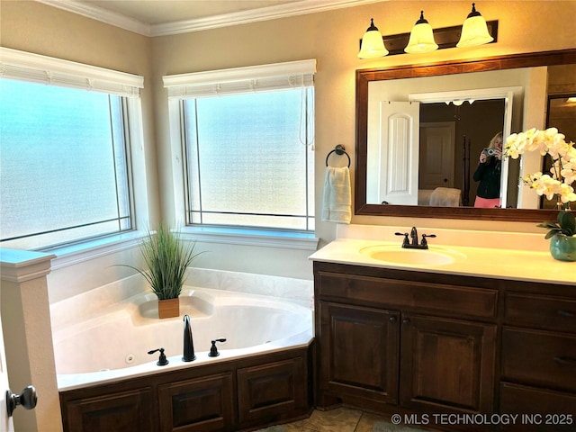 ensuite bathroom with plenty of natural light, a jetted tub, ensuite bathroom, and ornamental molding