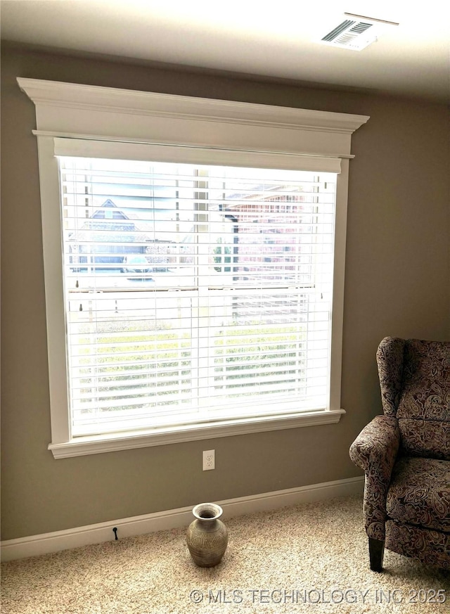 details featuring visible vents, baseboards, and carpet floors