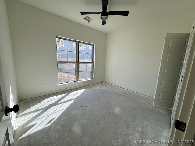 spare room with concrete flooring and ceiling fan