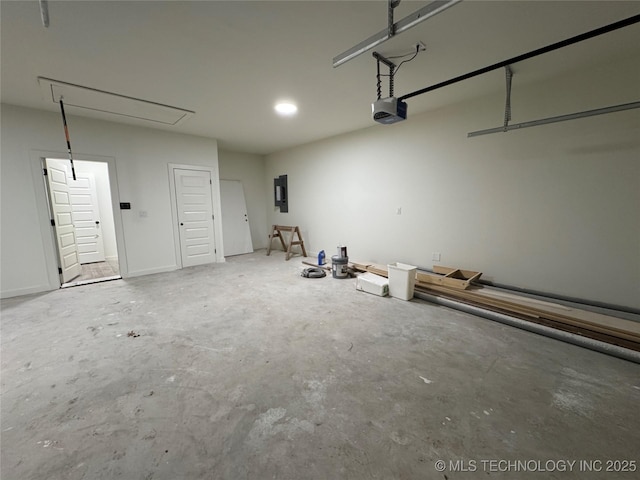 garage featuring electric panel and a garage door opener