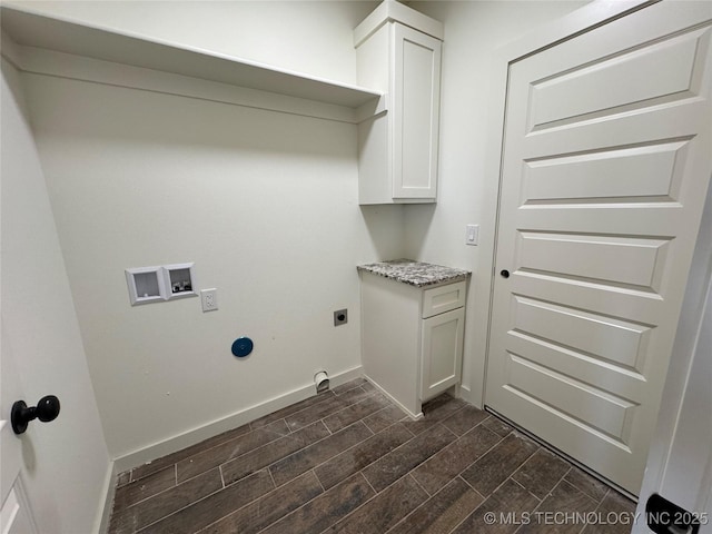 laundry area with baseboards, wood tiled floor, washer hookup, cabinet space, and hookup for an electric dryer