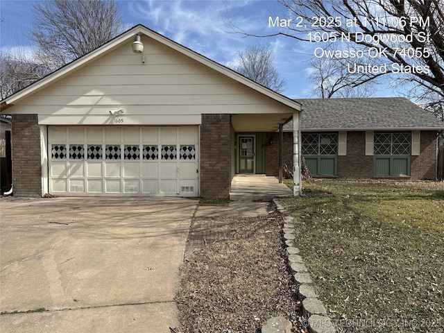 ranch-style home with brick siding, an attached garage, concrete driveway, and a shingled roof