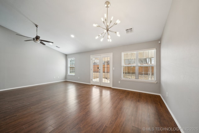 unfurnished living room with vaulted ceiling, dark wood-style floors, visible vents, and baseboards