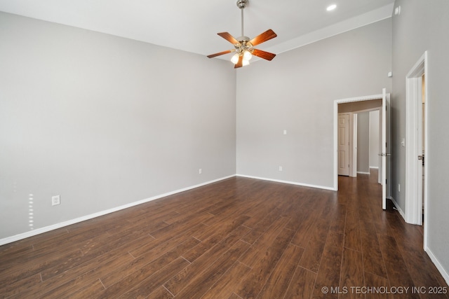 empty room with recessed lighting, baseboards, dark wood-type flooring, and a ceiling fan