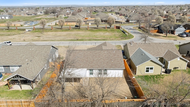 birds eye view of property with a residential view