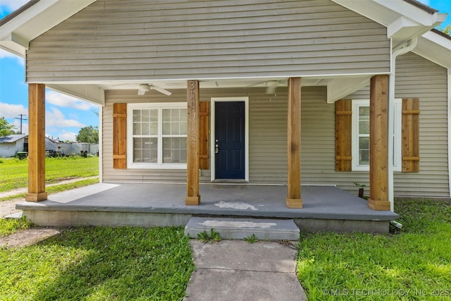 311 W 6th, Ada, OK 74820 - view of exterior entry featuring a porch and a ceiling fan