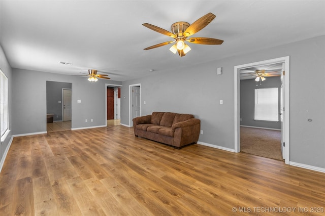 311 W 6th, Ada, OK 74820 - unfurnished room featuring a ceiling fan and light wood-style floors