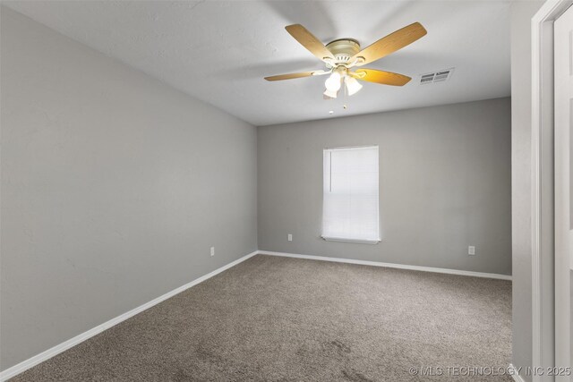 311 W 6th, Ada, OK 74820 - carpeted empty room with baseboards and ceiling fan