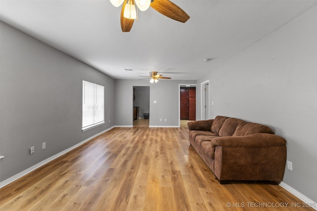 311 W 6th, Ada, OK 74820 - living room with ceiling fan and light wood finished floors