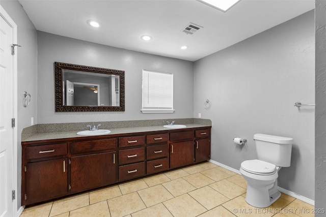 311 W 6th, Ada, OK 74820 - bathroom with double vanity, tile patterned flooring, and recessed lighting