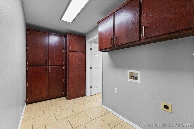 311 W 6th, Ada, OK 74820 - washroom with cabinet space, hookup for an electric dryer, washer hookup, and light tile patterned floors