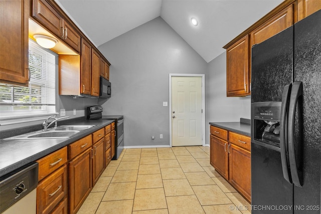 311 W 6th, Ada, OK 74820 - kitchen with black appliances, dark countertops, high vaulted ceiling, light tile patterned floors, and recessed lighting