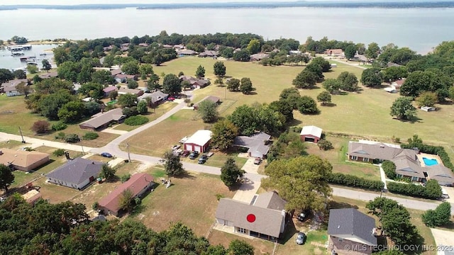 drone / aerial view with a residential view and a water view