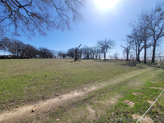 view of yard with a rural view