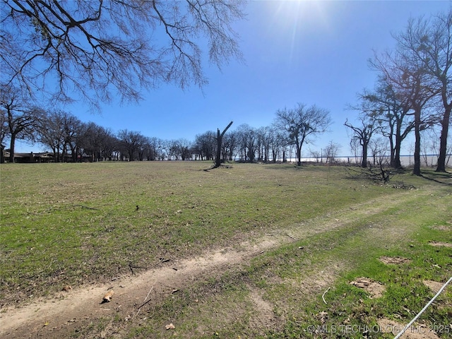 view of yard with a rural view