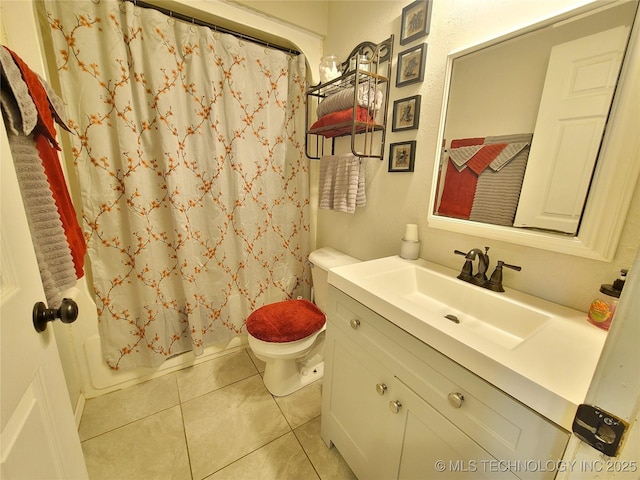 bathroom with tile patterned flooring, toilet, vanity, and shower / tub combo with curtain