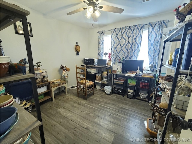 home office with ceiling fan and wood finished floors