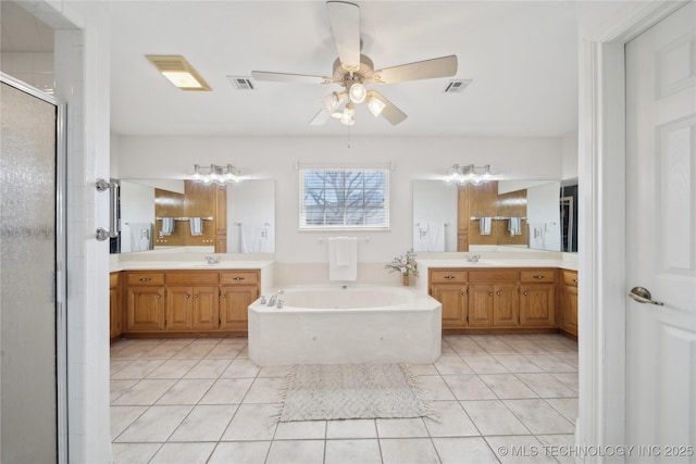 bathroom featuring a ceiling fan, visible vents, a sink, a shower stall, and a bath