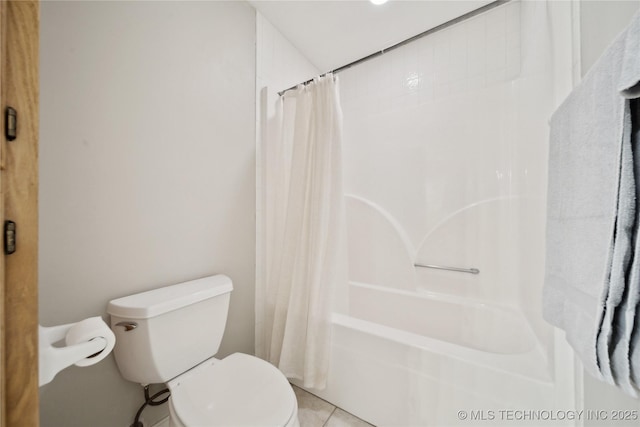 bathroom with toilet, shower / tub combo, and tile patterned flooring