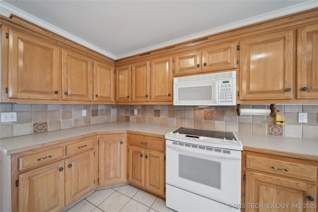 kitchen with light tile patterned floors, backsplash, white appliances, and light countertops