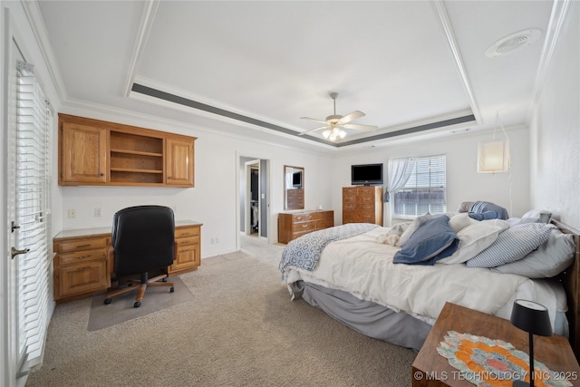 bedroom with visible vents, light colored carpet, crown molding, and a raised ceiling