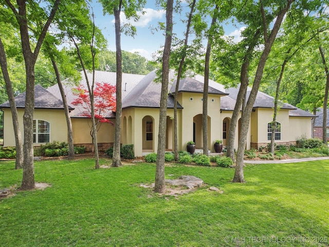 1721 E 136th Pl S, Bixby, OK 74008 - view of front facade with stucco siding, a front lawn, and stone siding