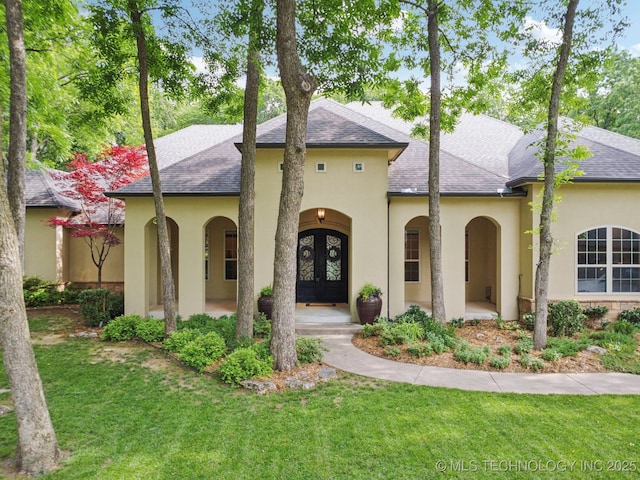 1721 E 136th Pl S, Bixby, OK 74008 - view of front facade featuring french doors, stucco siding, a front lawn, and a shingled roof
