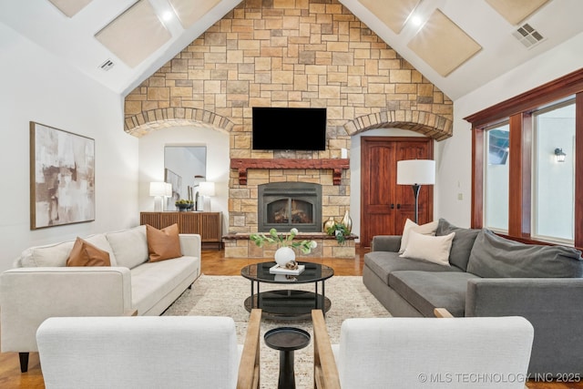 1721 E 136th Pl S, Bixby, OK 74008 - living area featuring wood finished floors, high vaulted ceiling, and a stone fireplace