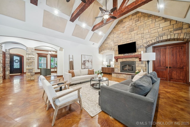 1721 E 136th Pl S, Bixby, OK 74008 - living area with ornate columns, a stone fireplace, a ceiling fan, beamed ceiling, and high vaulted ceiling