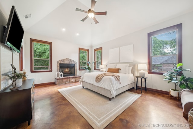 1721 E 136th Pl S, Bixby, OK 74008 - bedroom with a fireplace, lofted ceiling, ceiling fan, and concrete floors
